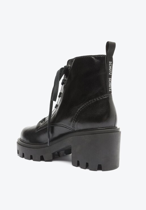 BOTA COTURNO PRETA SCHUTZ SALTO MÉDIO COURO