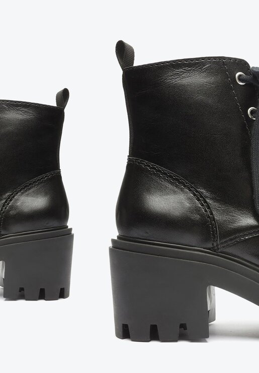 BOTA COTURNO PRETA SCHUTZ SALTO MÉDIO COURO
